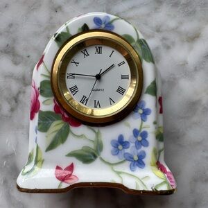 Floral porcelain miniature mantel clock with gold details